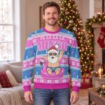 Man wearing the Fa La La La Mingo flamingo ugly Christmas sweater sweatshirt in a living room decorated for Christmas Man wearing the Fa La La La Mingo flamingo ugly Christmas sweater sweatshirt in a living room decorated for Christmas