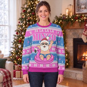 Woman wearing the Fa La La La Mingo flamingo Christmas sweatshirt with Santa on a pink flamingo float, by a Christmas tree