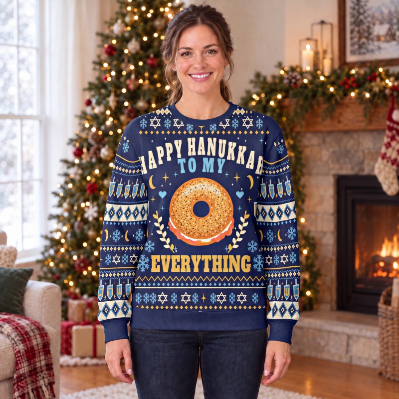 Woman wearing the navy Hanukkah bagel sweatshirt with EVERYTHING in gold under the bagel