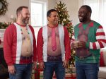 Three friends laughing in the Santa Vest, Santa Tie and Elf Vest funny Santa sweaters, each with the skin tone that matches his own Three friends laughing in the Santa Vest, Santa Tie and Elf Vest funny Santa sweaters, each with the skin tone that matches his own