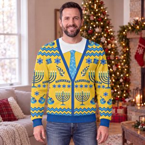 Man wearing the Hanukkah cardigan sweater, a yellow sweatshirt with a printed blue cardigan, white collar and menorah tie