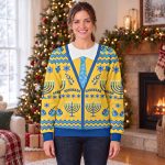 Woman wearing the yellow Hanukkah cardigan sweatshirt with a printed tie and HANUKKAH on both sides of the chest Woman wearing the yellow Hanukkah cardigan sweatshirt with a printed tie and HANUKKAH on both sides of the chest
